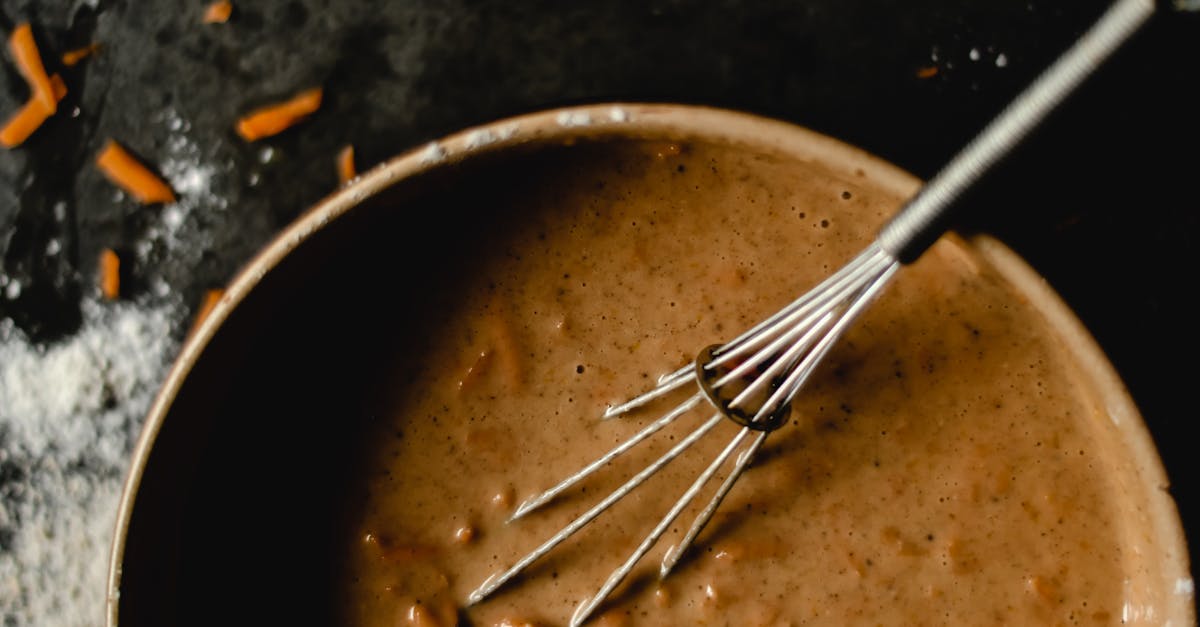 a bowl of carrot cake batter with whisk showcasing baking ingredients and preparation 2