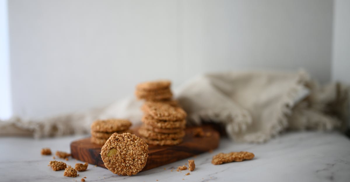 a close up of homemade anzac biscuits stacked on a wooden tray evoking warmth and nostalgia
