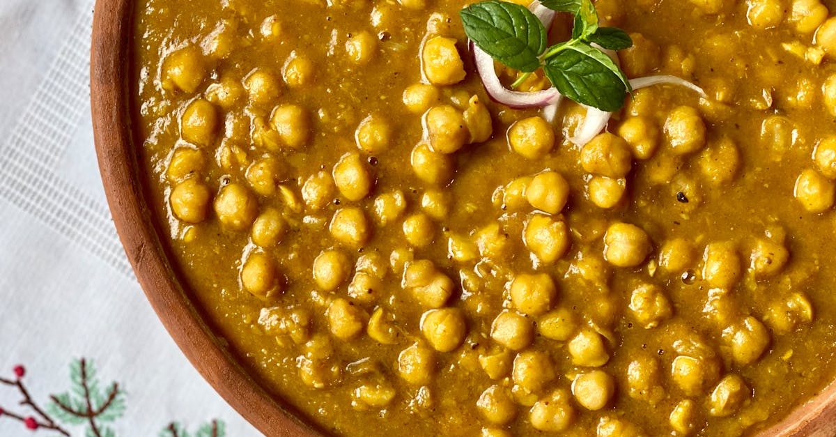 a close up of traditional indian chana masala garnished with fresh herbs showcasing its rich and ap 3