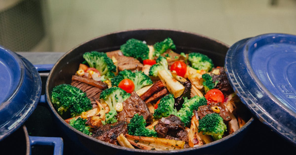a colorful dish of roasted vegetables and meat in a blue casserole pot ideal for family dinners 7