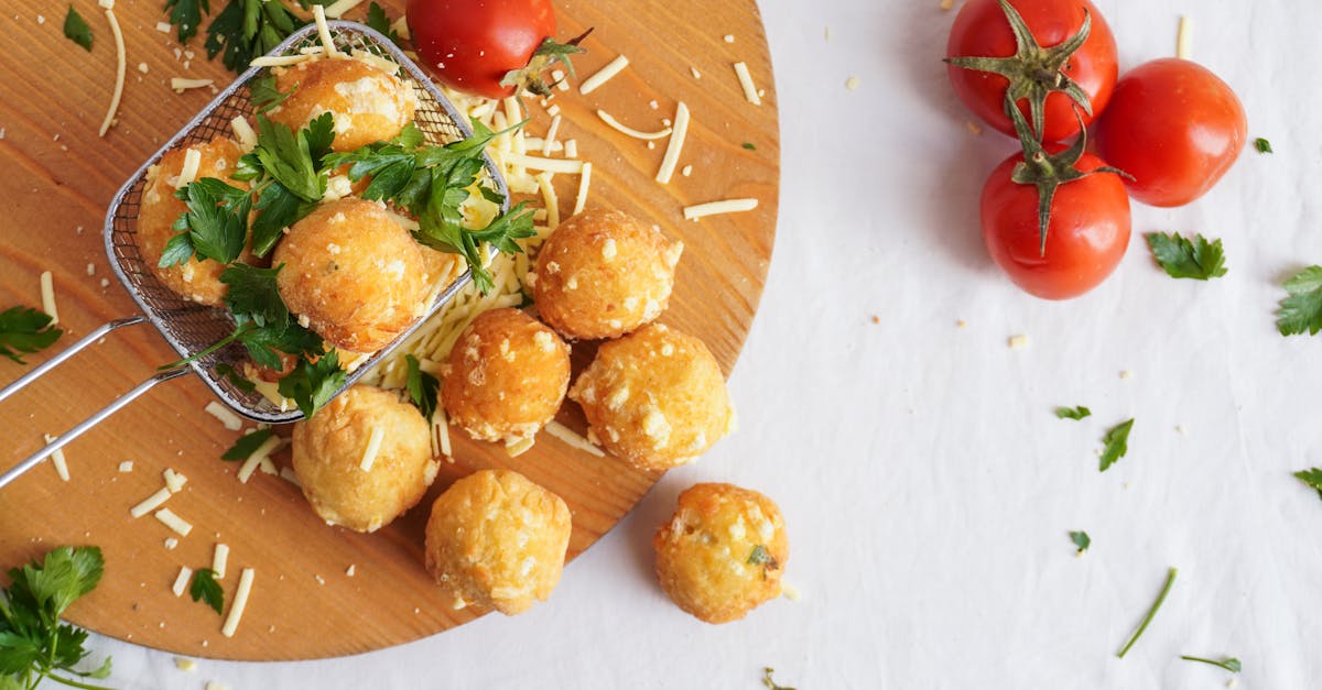 a colorful flat lay of cheese balls garnished with parsley and fresh tomatoes perfect for a tasty s 1