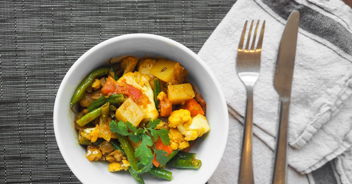 a delicious bowl of vegetable curry topped with fresh cilantro perfect for a healthy meal