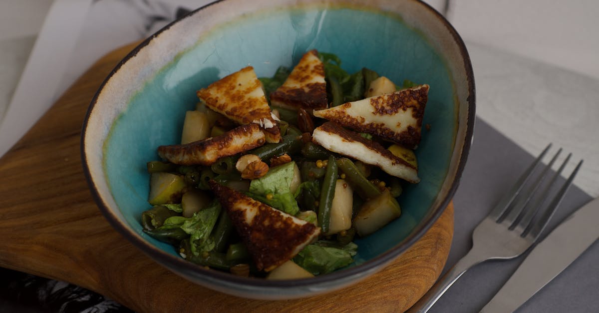 a delicious halloumi salad with fresh greens in a stylish turquoise bowl