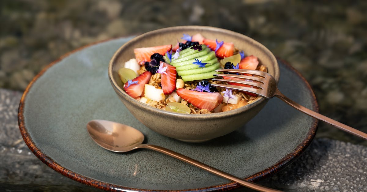 a deliciously colorful fruit and granola bowl set outdoors perfect for health conscious food lovers