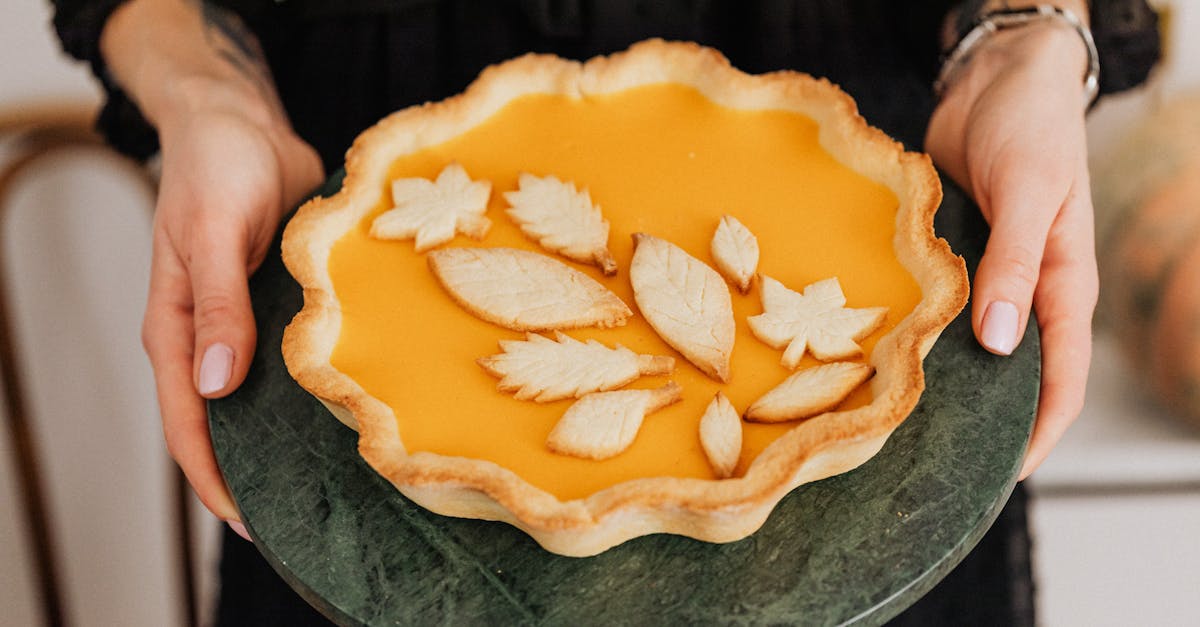 a delightful homemade pumpkin pie with decorative leaf shapes perfect for autumn celebrations 17