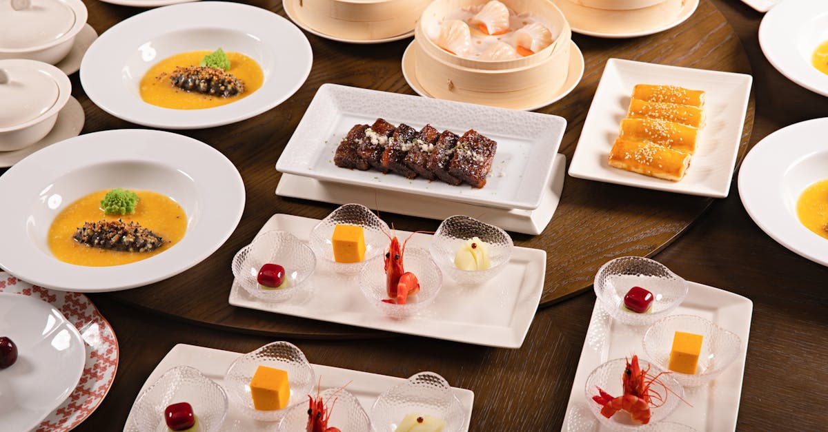 a diverse spread of chinese dishes elegantly arranged on a round table for a gourmet dining