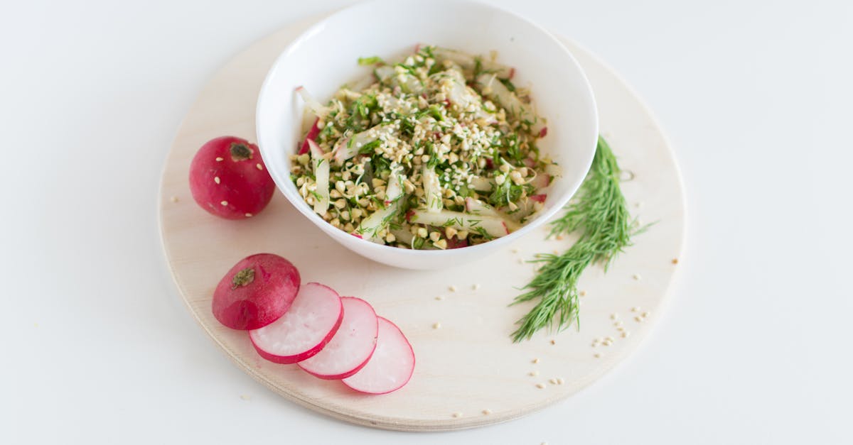 a healthy vegan salad with buckwheat radish and dill garnished with sesame seeds 2