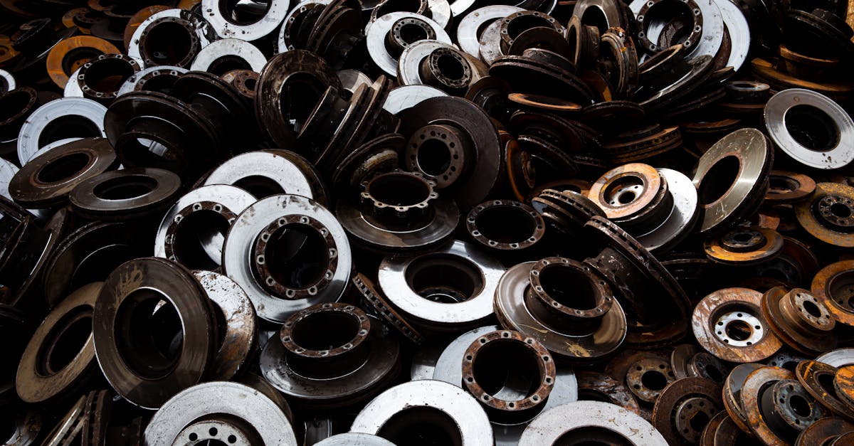 a pile of recycled metal brake discs showcasing industrial recycling