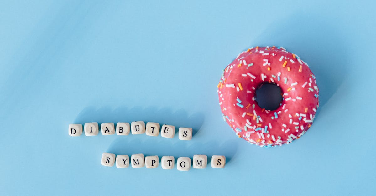 a pink frosted donut with diabetes symptoms text on a blue background highlighting awareness