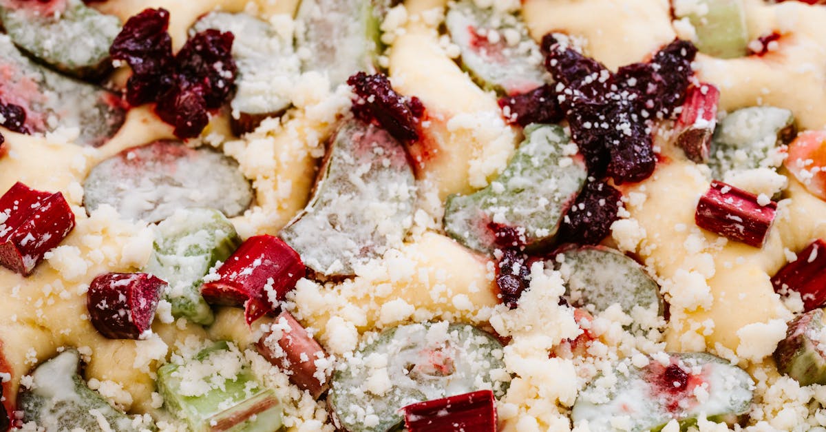 a vibrant close up of a rhubarb cake topped with crumble and berries deliciously enticing 2