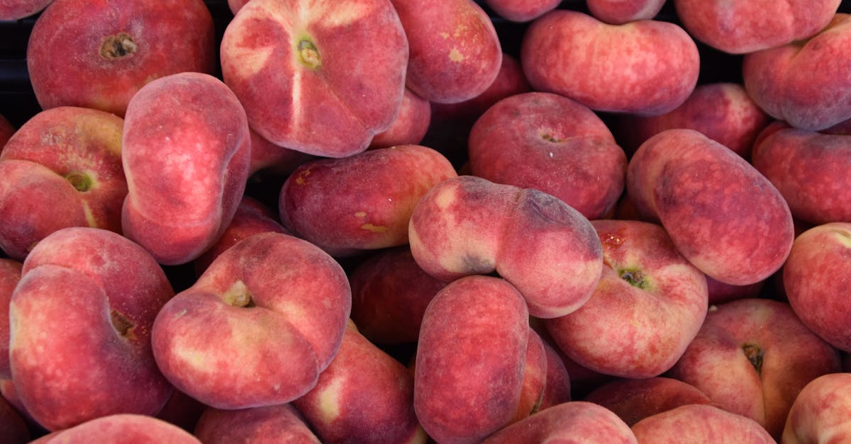 a vibrant display of ripe donut peaches at a local market stand showcasing freshness and abundance 1