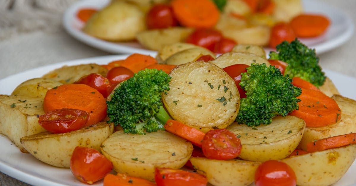 a vibrant platter of roasted vegetables featuring potatoes broccoli and carrots