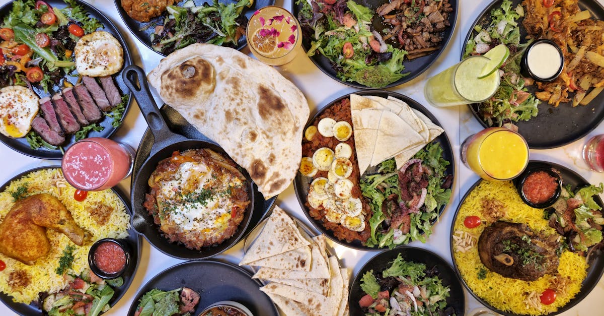 a vibrant spread of middle eastern dishes with fresh salads and drinks captured in vancouver
