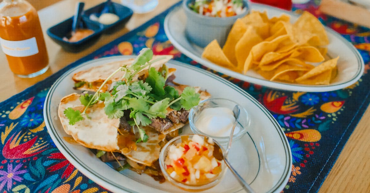 a vibrant spread of quesadillas and chips on a colorful tablecloth