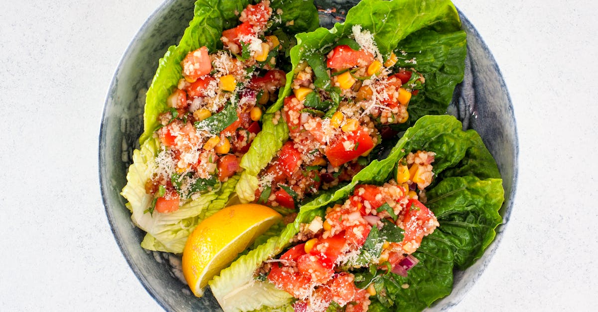 a vibrant vegetable salad with romaine lettuce tomatoes and corn served in a stoneware bowl with a