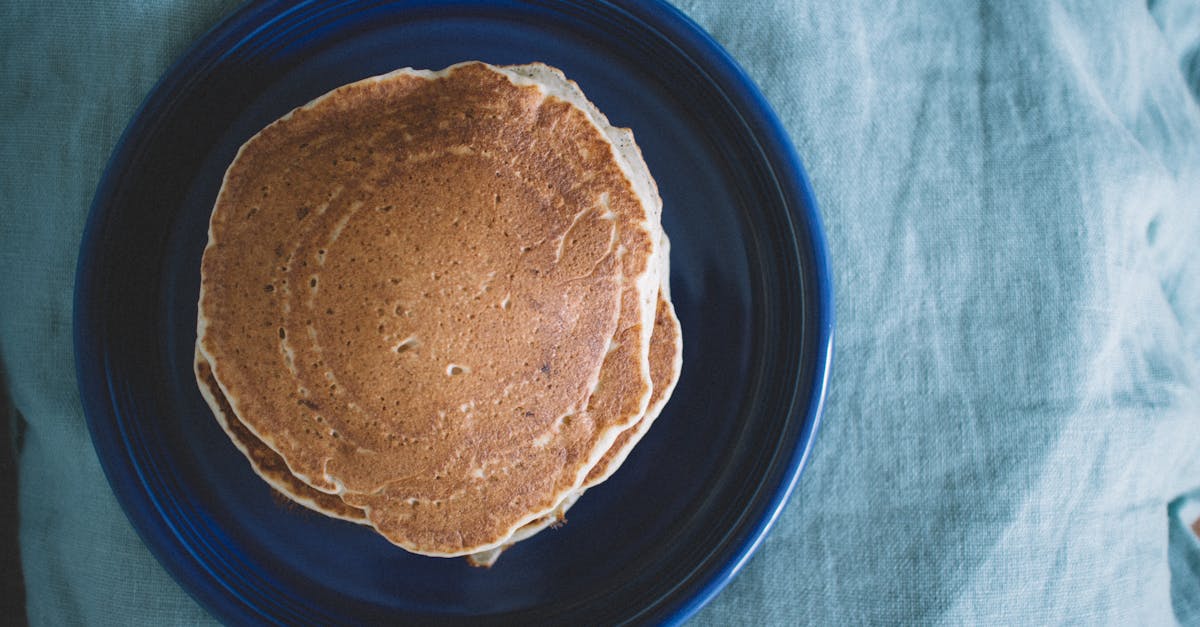 aerial view of homemade pancakes on a blue plate ready for breakfast
