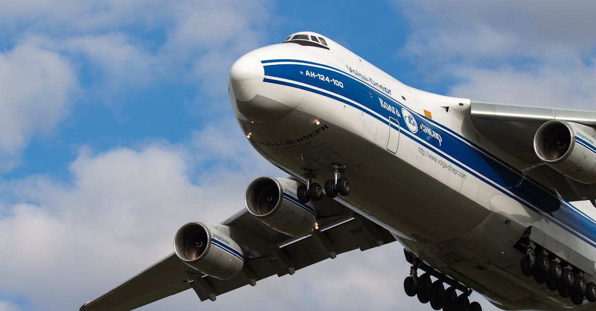 antonov an 124 cargo plane in flight with cloudy sky background in budapest