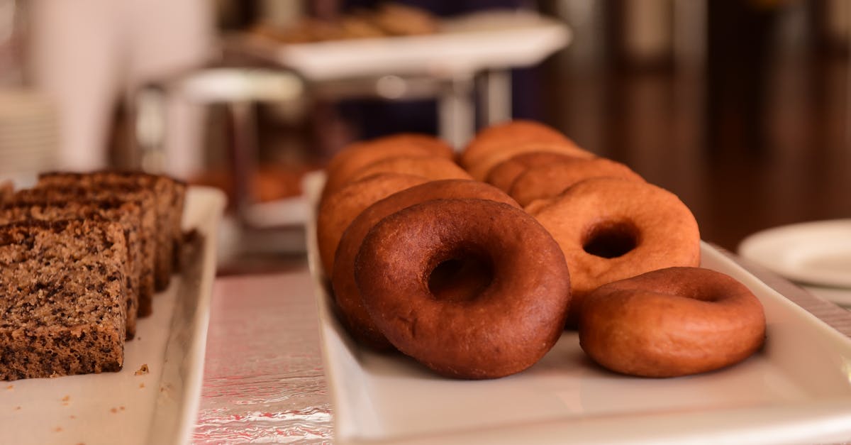 appetizing display of donuts and cakes on trays perfect for bakery or dessert showcases