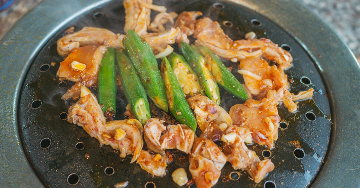 appetizing grilled chicken and okra sizzling on a korean barbecue grill ready to serve 2