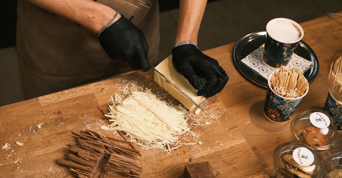 barista skillfully preparing gourmet hot chocolate with white and dark chocolate shavings