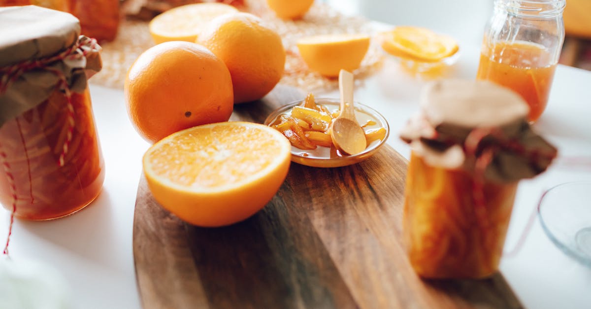 bright and fresh homemade orange jam with sliced oranges on a wooden board