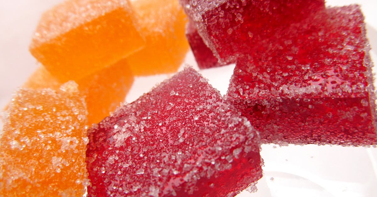 bright and vibrant sugar coated red and orange jelly candies in a close up macro shot 2
