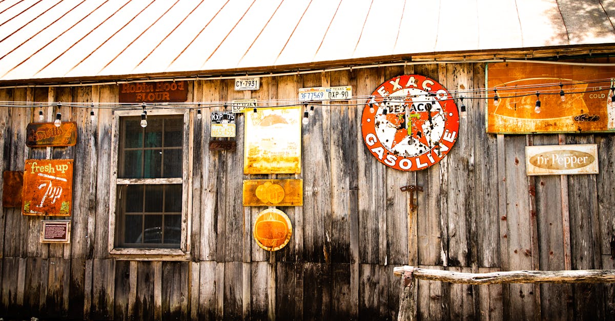 charming rustic barn exterior featuring texaco gasoline sign and vintage advertisements