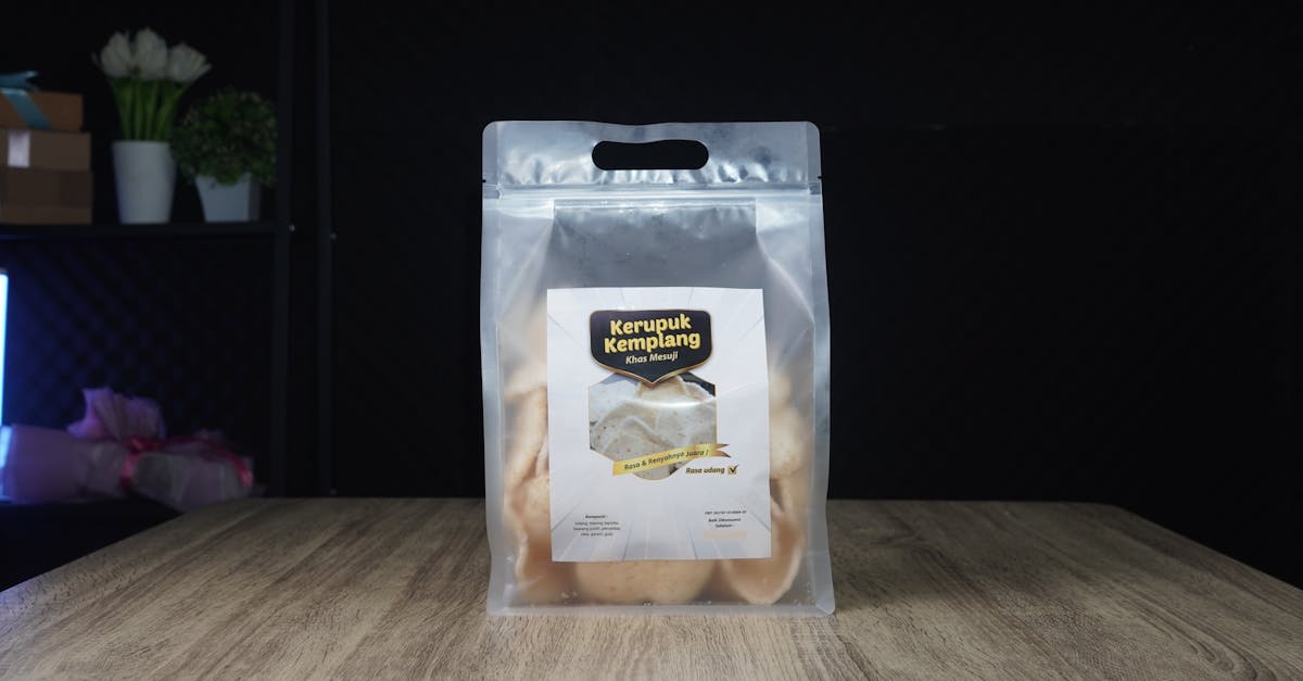 clear packaging of kerupuk kemplang shrimp crackers on a wooden table