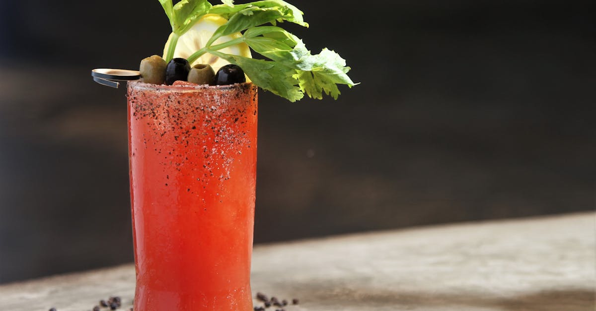 close up of a bloody mary cocktail with celery olives and lemon garnish perfect for any brunch se 1