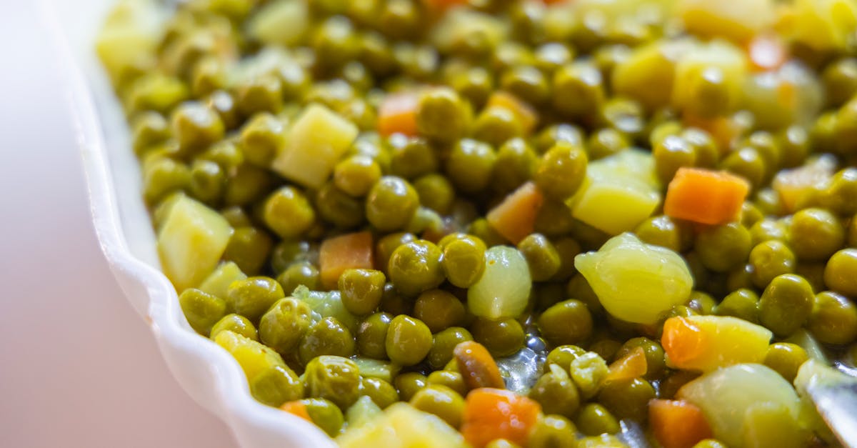 close up of a delicious mixed vegetable side dish featuring peas carrots and potatoes 1