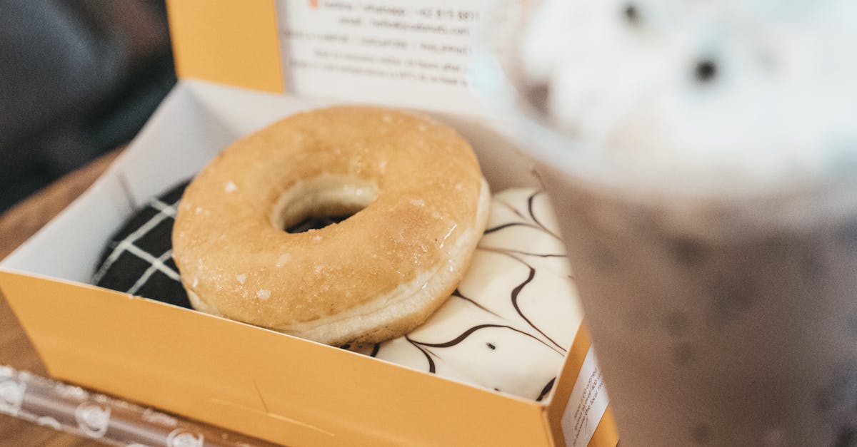 close up of a donut and iced coffee captured in a bandung cafe setting