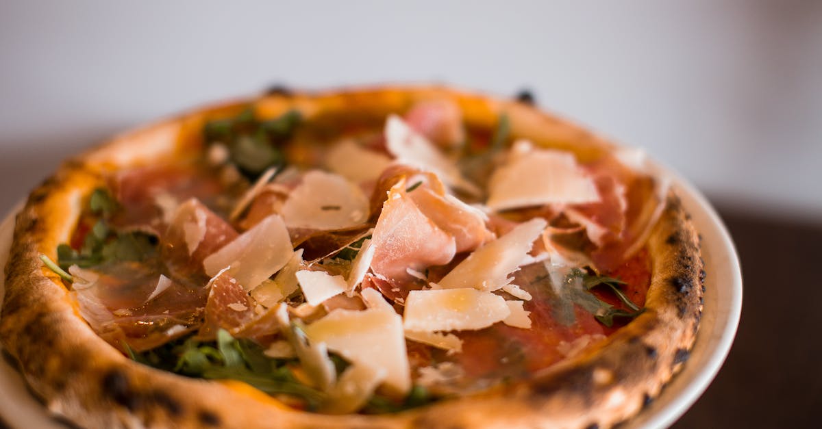 close up of a gourmet pizza with parma ham and parmesan cheese showcasing italian cuisine 2