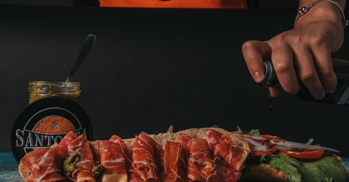 close up of a gourmet sandwich being prepared with fresh ingredients and sauces 14