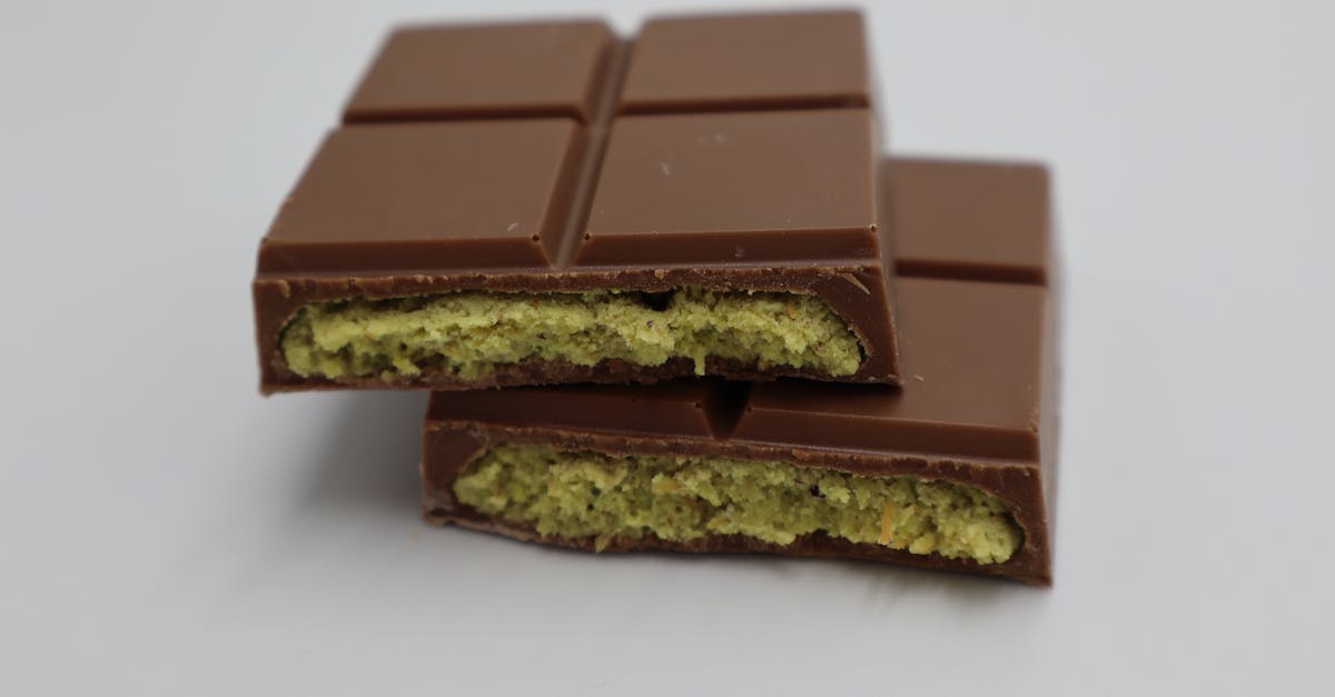 close up of a milk chocolate bar with pistachio filling showcasing its delectable