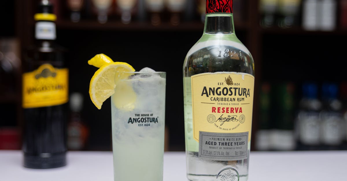 close up of a refreshing cocktail made with angostura rum and lemon garnish perfect for summer 1