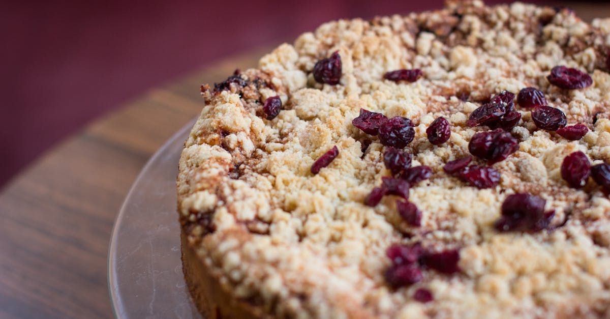 close up of a tasty homemade berry crumble cake on a wooden surface perfect for desserts