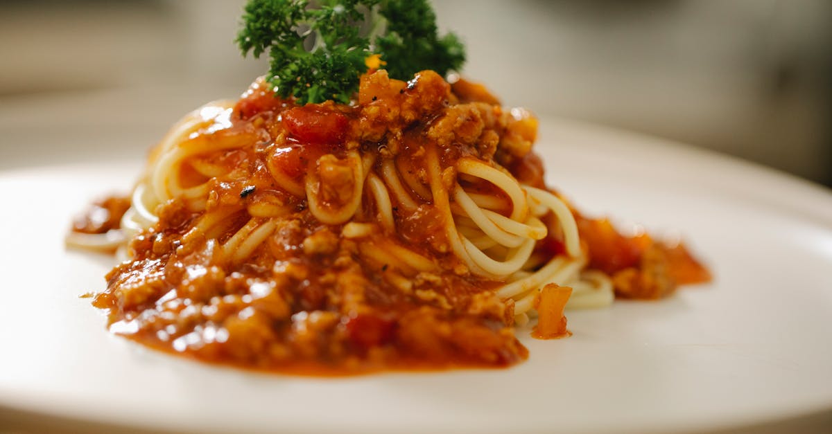 close up of a tempting spaghetti bolognese dish topped with fresh parsley perfect for italian cuisi 1