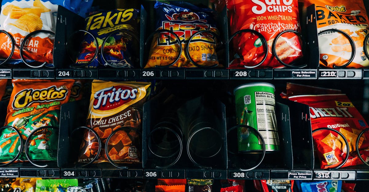 close up of a vending machine filled with popular snack brands like cheetos and fritos 1