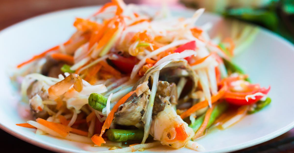 close up of a vibrant thai papaya salad with fresh vegetables and herbs 2