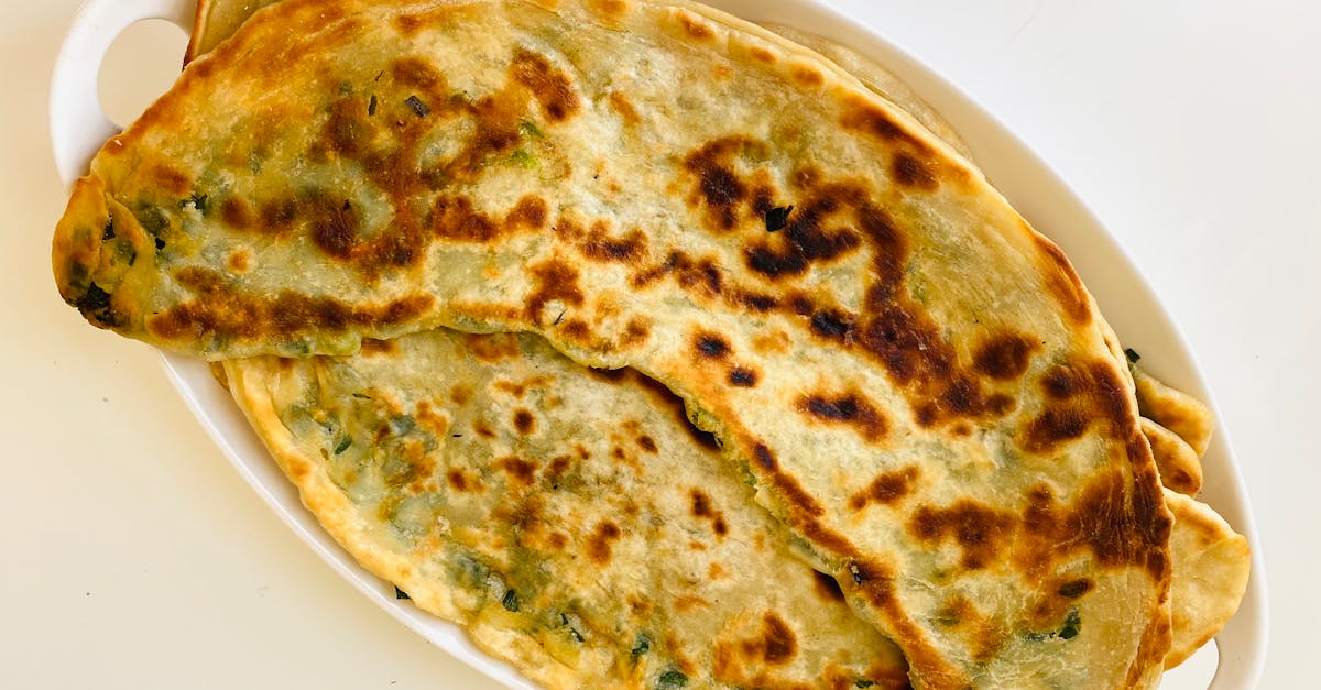 close up of delicious homemade stuffed flatbread on a white tray perfect for breakfast or a savory