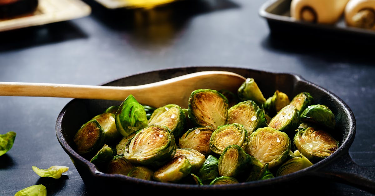 close up of delicious roasted brussels sprouts in a cast iron skillet perfect for a healthy meal