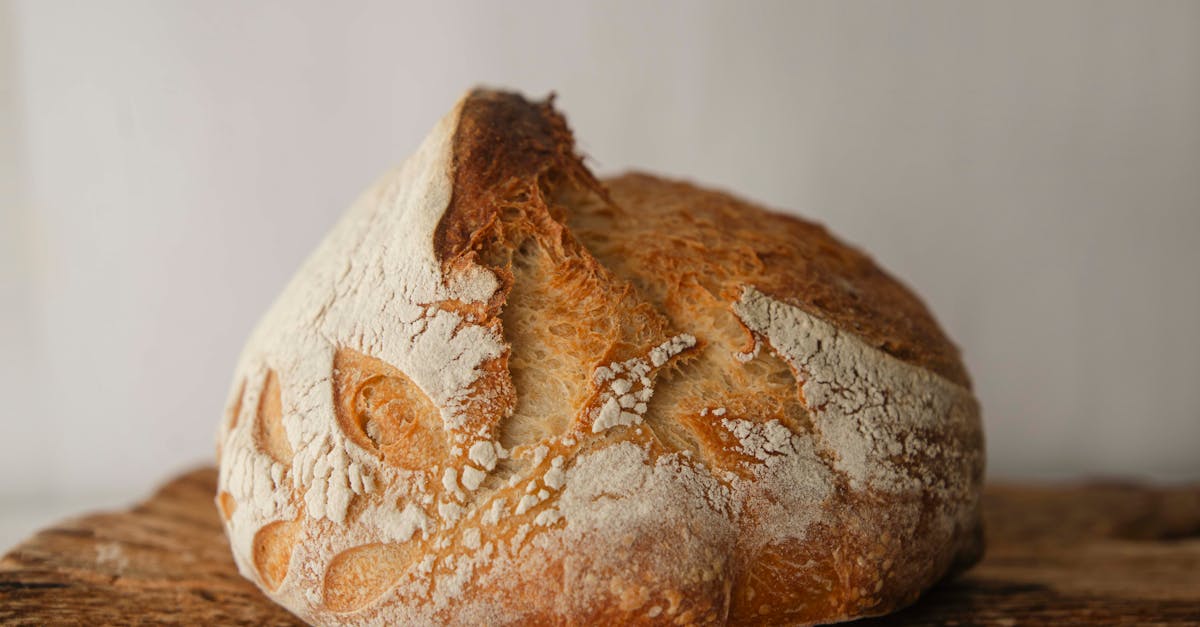 close up of freshly baked artisan sourdough bread on a rustic wooden board