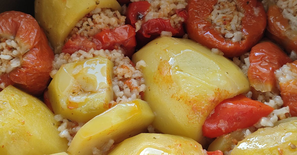 close up of freshly cooked stuffed peppers and potatoes filled with rice 1
