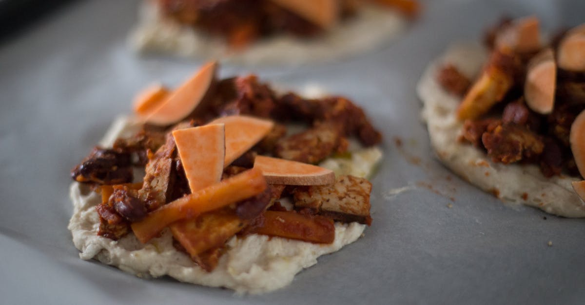 close up of homemade flatbreads with sweet potatoes and seasoned vegetables