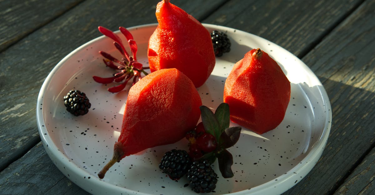close up of poached pears and blackberries on a white plate perfect healthy dessert 1