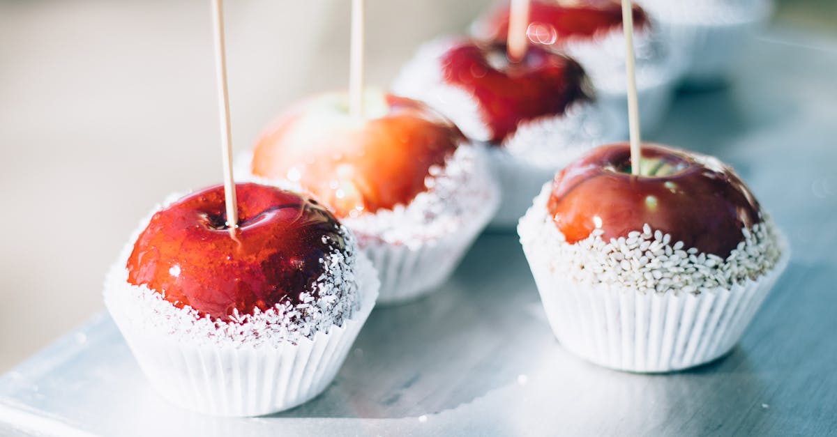 close up of red caramel apples with sugar coating on sticks perfect for sweets and confectionery th