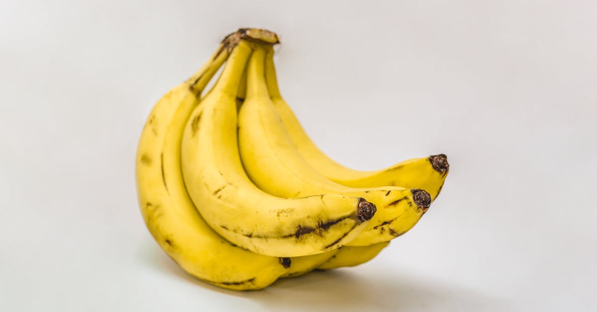 close up of ripe organic bananas on a neutral background showcasing texture and freshness 1