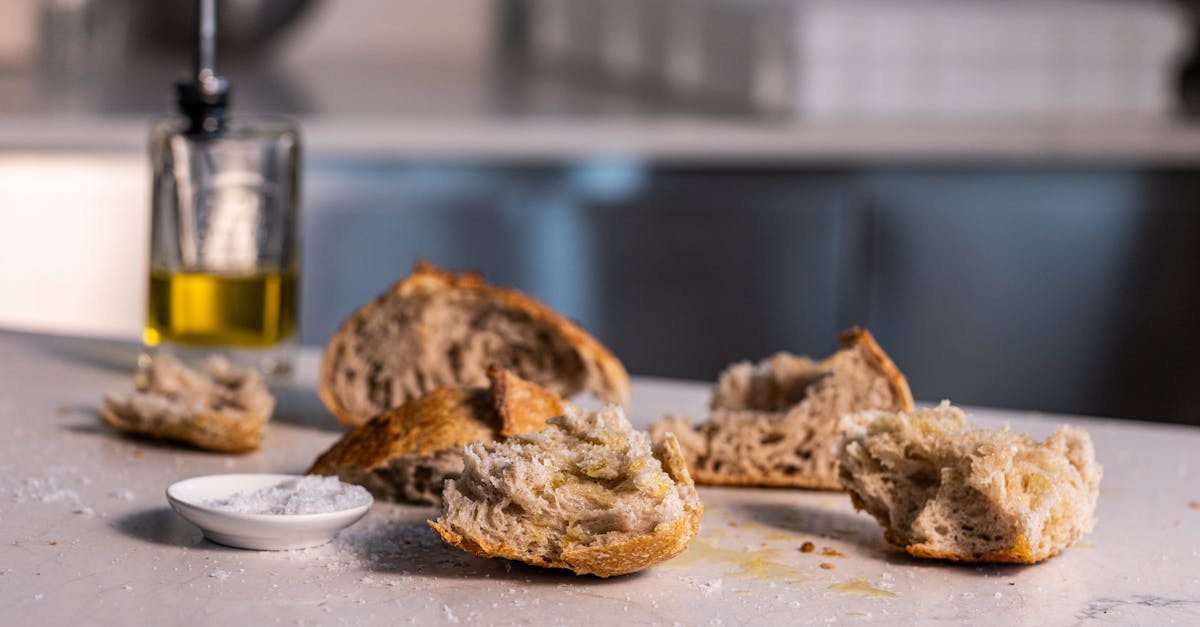 close up of rustic bread and olive oil on a marble countertop ideal for food related content