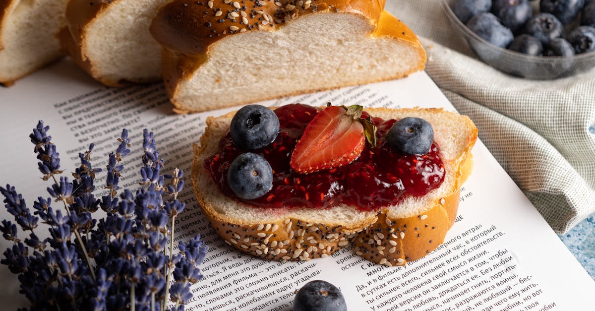 close up of seeded bread with berry jam fresh blueberries and strawberries 3