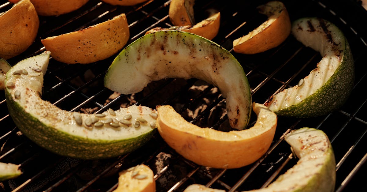 close up of sliced cantaloupe and melon on a barbecue grill perfect for summer cooking